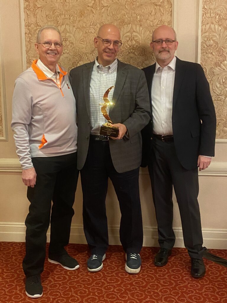 Charles received his award from Doug Erickson and John Williams at the March meeting for the HGRC.